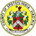 Seal of Spotsylvania VA, featuring a cest on a background of yellow, with the text 'County of Spotsylvania Virginia.'
